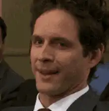Tom Hiddleston smirking and nodding