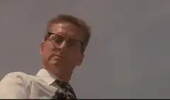 Hans Landa raises a submachine gun