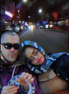 Couple selfie on a moving bus at night