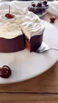 fork taking bite of chocolate cake