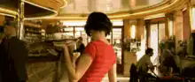 Woman in red shirt turns head