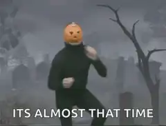 Pumpkin head dancing in graveyard