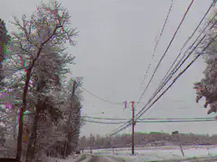 Snowy road with power lines