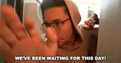 Man in hoodie waiting excitedly
