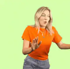 Woman in orange shirt dancing excitedly