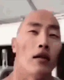 Bald man nodding in gym