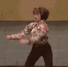 Woman in floral shirt dancing