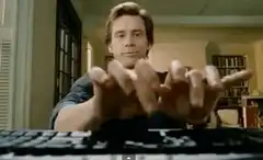 Jim Carrey typing with long fingers
