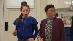Girl and boy react to raisins in food