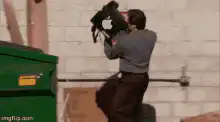 Man throws Apple laptop into dumpster