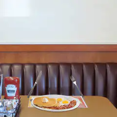 Fork eats bacon in diner