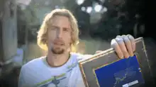 Man holding framed stock chart