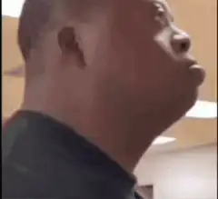 Man turns head and sticks tongue out