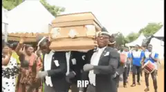 Dancing pallbearers carrying coffin