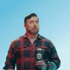 Man cools head with beer can