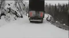 Semi truck jackknifes and rolls over in snow