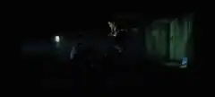 Woman kicks man in dark room