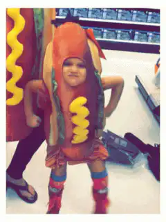 Toddler in hot dog costume dancing