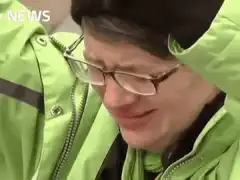 Man in green jacket crying and screaming