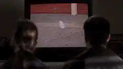 Couple watching a plastic bag on TV