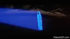 Glowing blue figure in spotlight