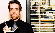 Bobby sitting at his desk in The Office