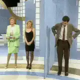 Man dancing behind a screen on a game show