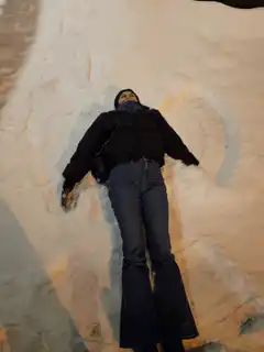Person making snow angels