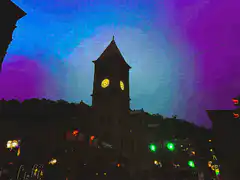 clock tower with shifting psychedelic sky