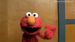 Elmo waving hello