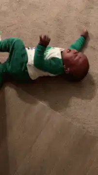 Baby crying on carpet