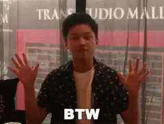 Asian man shrugging with BTW text