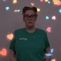 Woman in green shirt with floating hearts