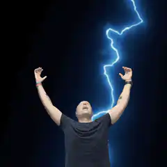Man raising arms with lightning