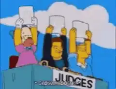 Simpsons judges holding up 45 scorecards