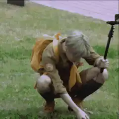 Scout with selfie stick crouching