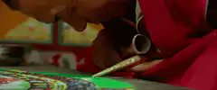 Monk creating sand mandala