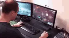 Man multitasking gaming and phone
