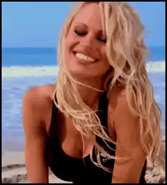 Pamela Anderson smiling on the beach
