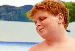 Kid blowing a kiss and waving