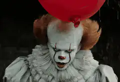 Pennywise the Dancing Clown with Red Balloon