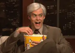 Bill Hader eating popcorn with wide eyes