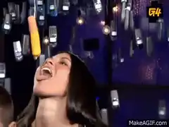 Woman catches corn dog in mouth