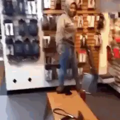 Woman slips on red shoes in store