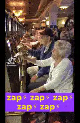 elderly people playing slot machines in a row