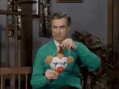 Mr. Rogers puts on a clown mask