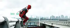 Deadpool jumps off a bridge