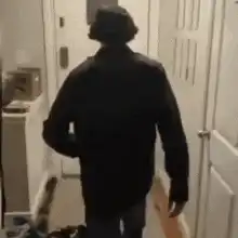 Man walks into bathroom