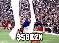 Shirtless man jumps over cheerleaders