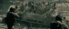 Soldiers firing machine guns from a vehicle